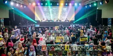 Attendees enjoying a bustling Dorama fan convention in the United States, 2026, showcasing vibrant cosplay and merchandise.